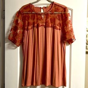 Peach sheer sleeve shirt.